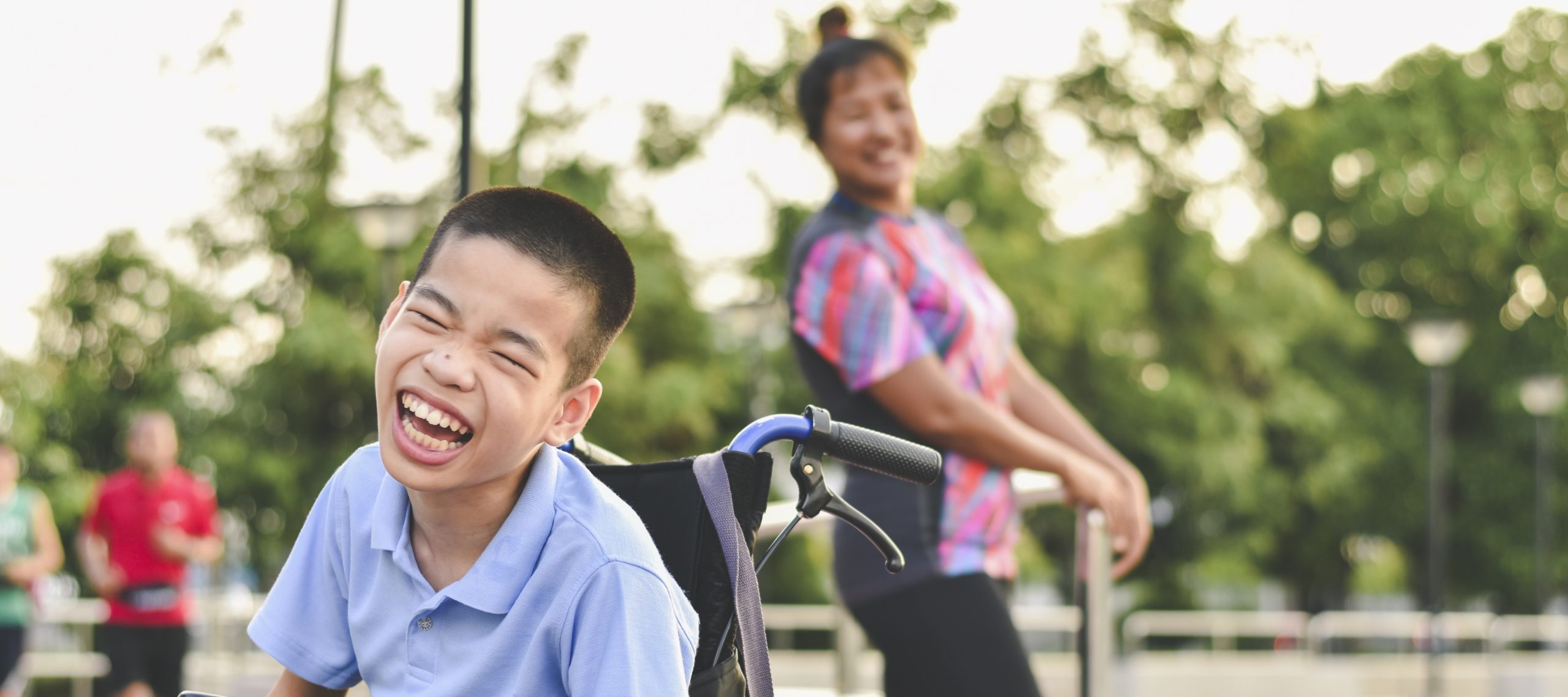 Disabled child on wheelchair is play and learn in the outdoor park like other people, Life in the education age of special children, Happy disability kid concept. Disabled child on wheelchair is play and learn in the outdoor park like other people, Life in the education age of special children, Happy disability kid concept.